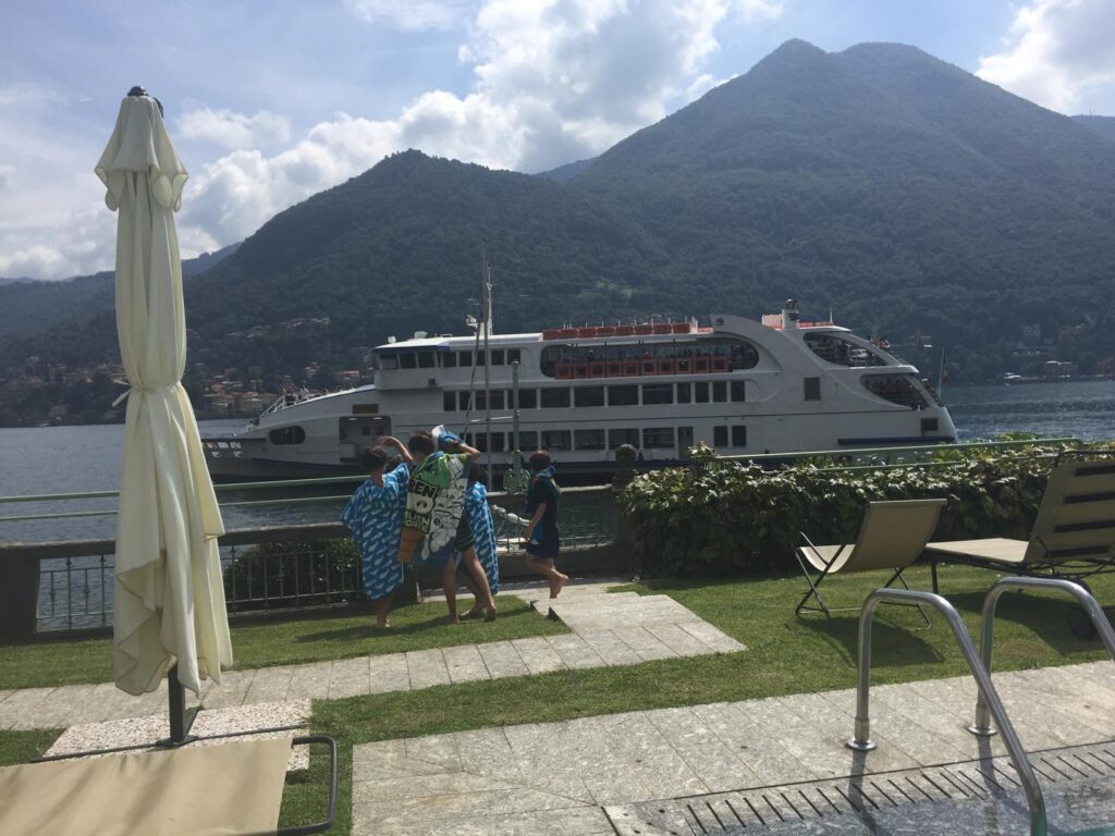 One of the boats seen from the pool where we were staying once in Moltrasio. Photo: The-Ski-Guru. Ultimate Guide to Lake Como.
